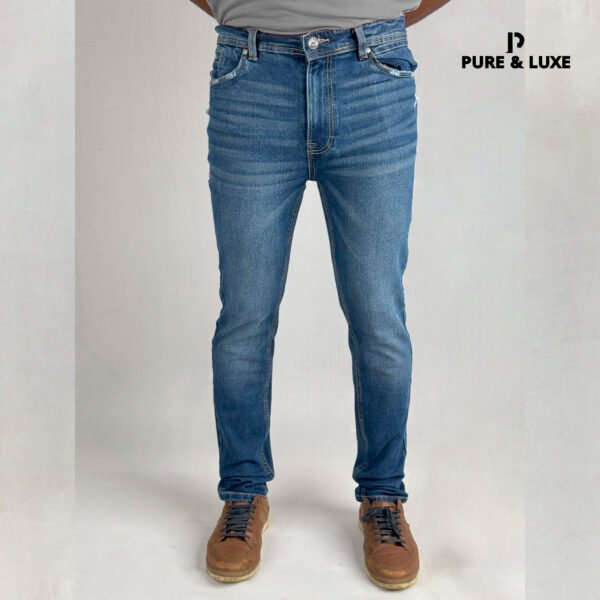Man wearing Hard Grind Indigo Slim Fit Jeans by Pure & Luxe – front view