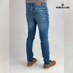 Man wearing Hard Grind Indigo Slim Fit Jeans by Pure & Luxe – back view