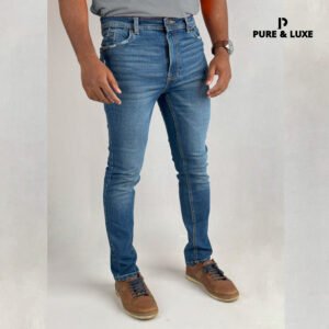 Man wearing Hard Grind Indigo Slim Fit Jeans by Pure & Luxe – right front view