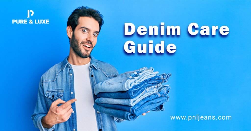 Smiling man holding folded denim jeans in his left hand while pointing with his right hand — demonstrating denim care and maintenance tips.