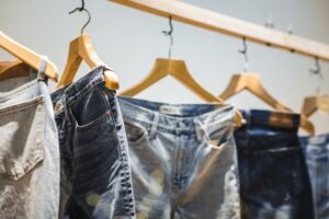 Hanging jeans to air dry — showcasing proper drying technique to preserve fabric quality and ensure denim care