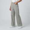 Female model wearing PURE & LUXE Ash Grey Frayed panel Baggy fit Jeans featuring vertical raw-edge detailing and a relaxed wide-leg silhouette.